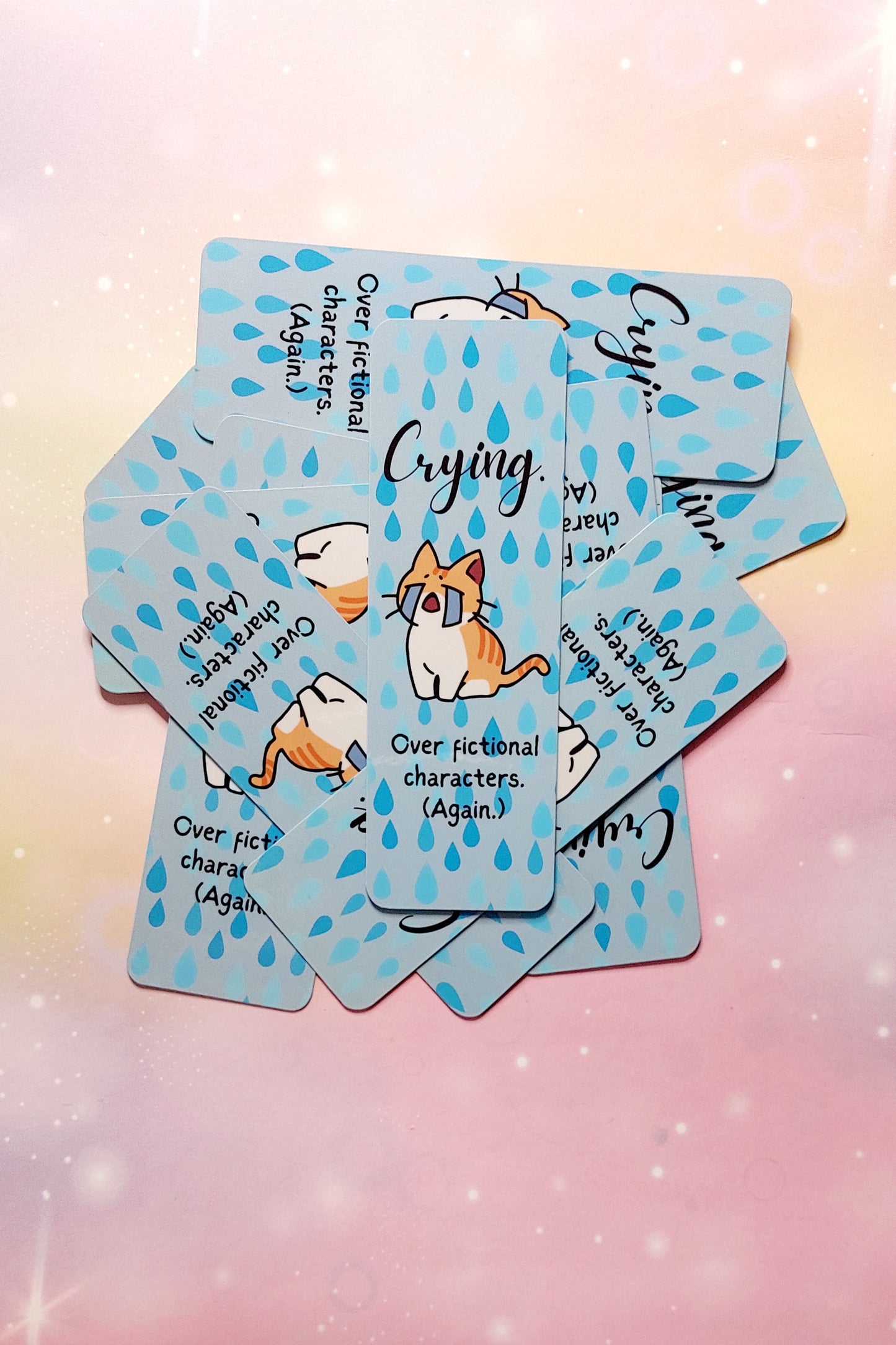 Funny bookmark cat crying over fictional characters